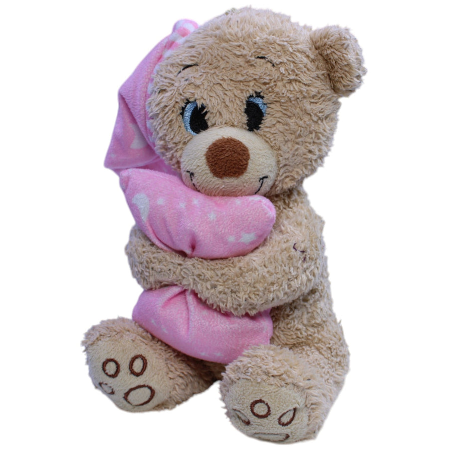 Süßer Teddy mit Schlafmütze und Kissen