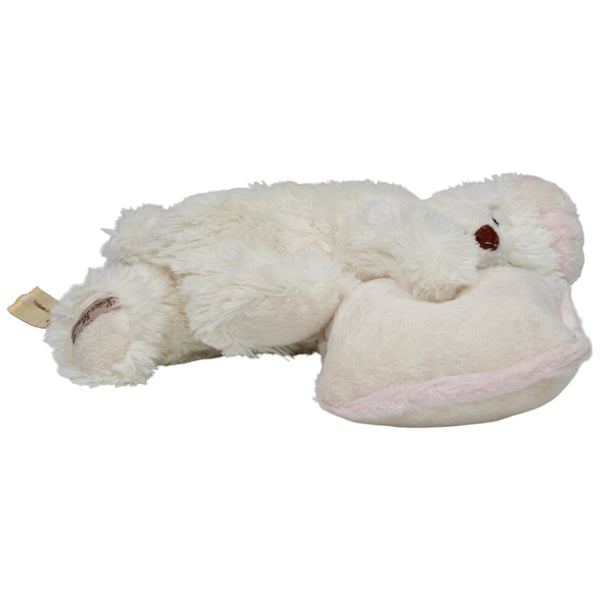 Schlafender weißer Teddybär mit Kissen