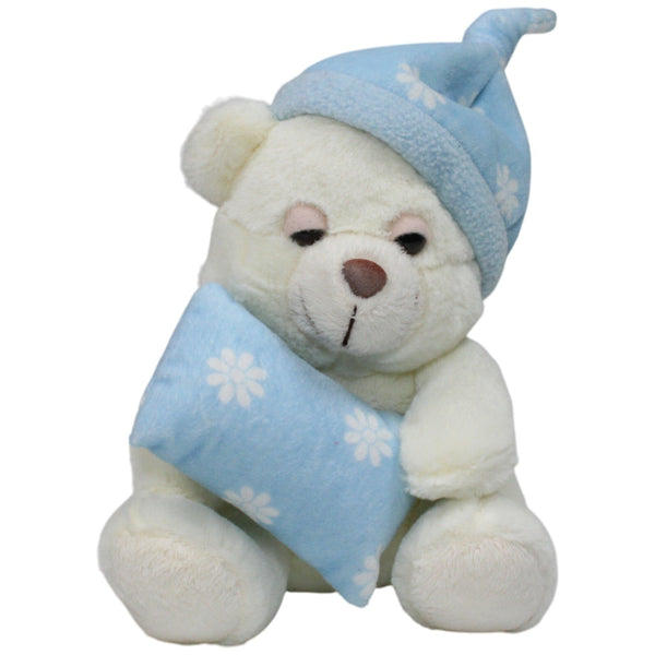 Süßer heller Teddy mit Schlafmütze und Kissen