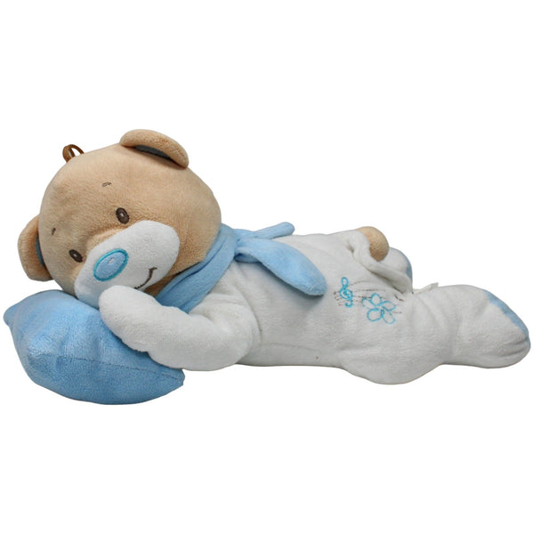 Großer liegender Teddybär mit Kissen
