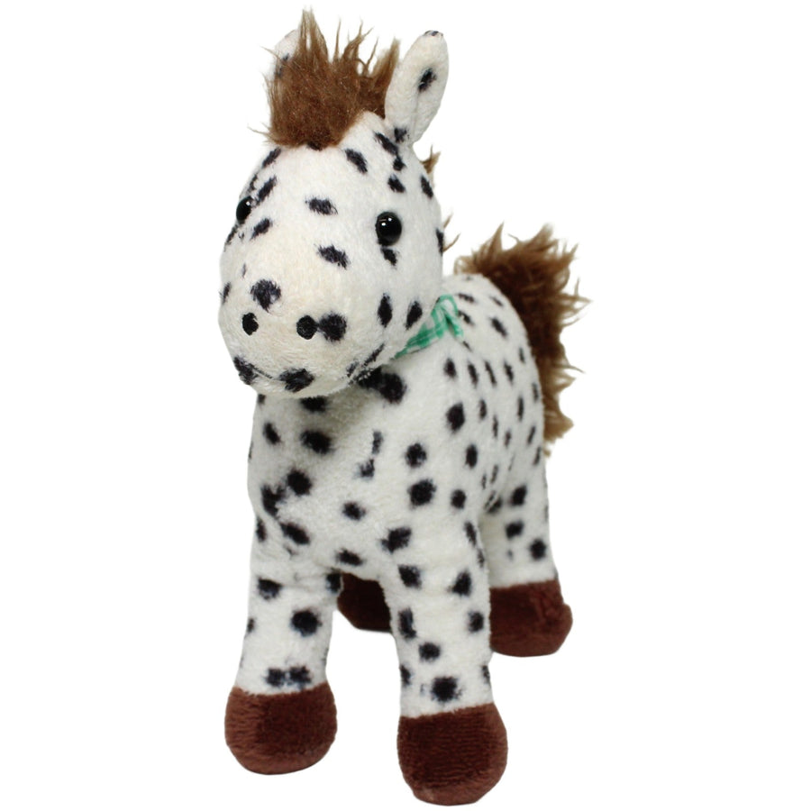 Schönes weißes Pony mit schwarzen Punkten