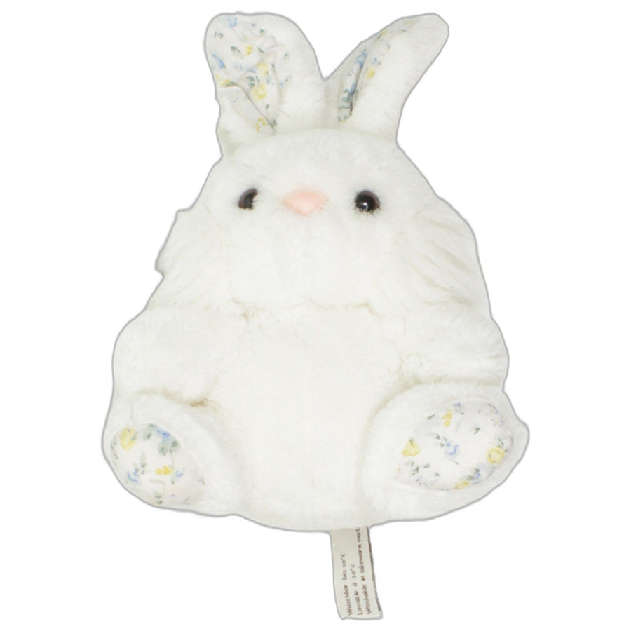 Weißer Hase mit Blumenmuster an den Ohren und Füßen