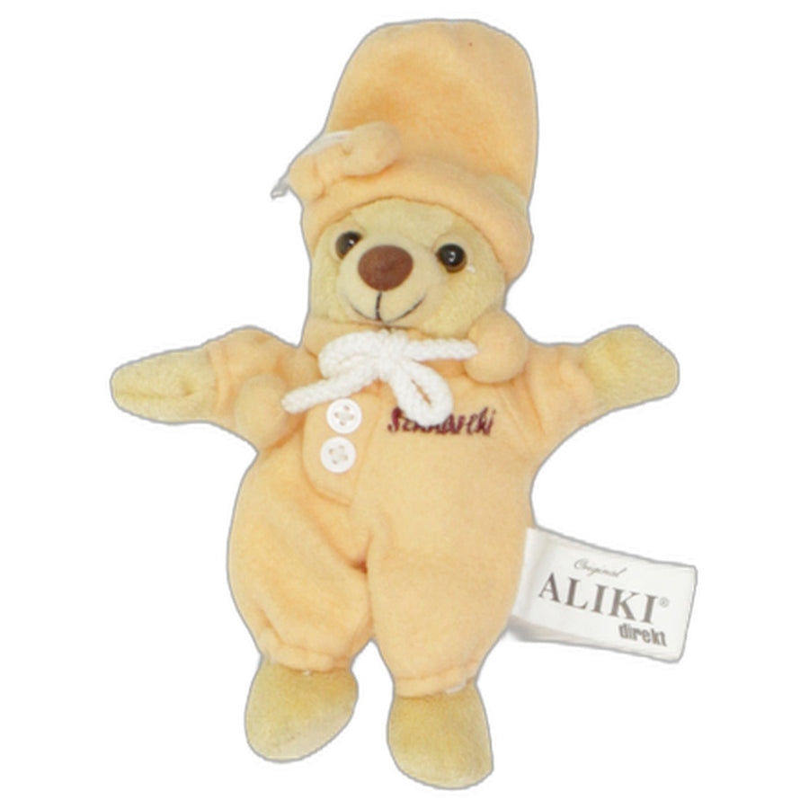 Teddybär mit oranger Kleidung