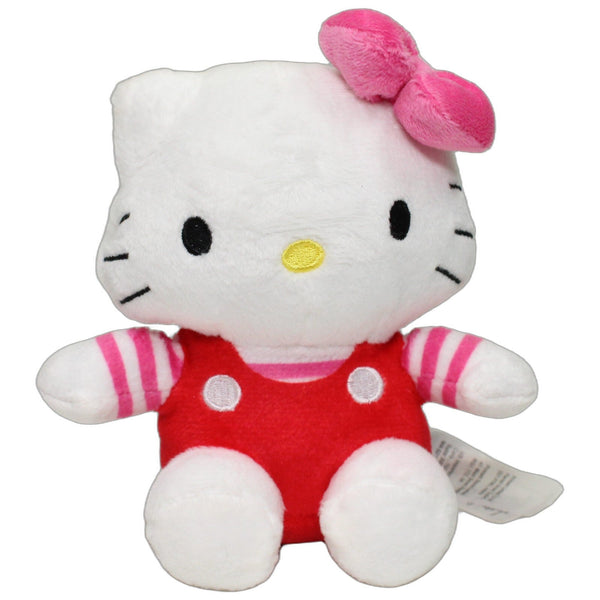 Hello Kitty in roter Latzhose, sitzend