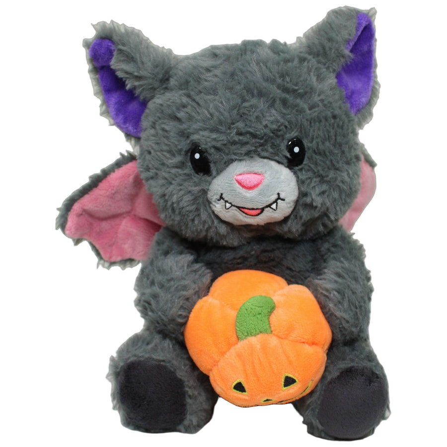 Süße Halloween-Fledermaus mit Kürbis, sitzend