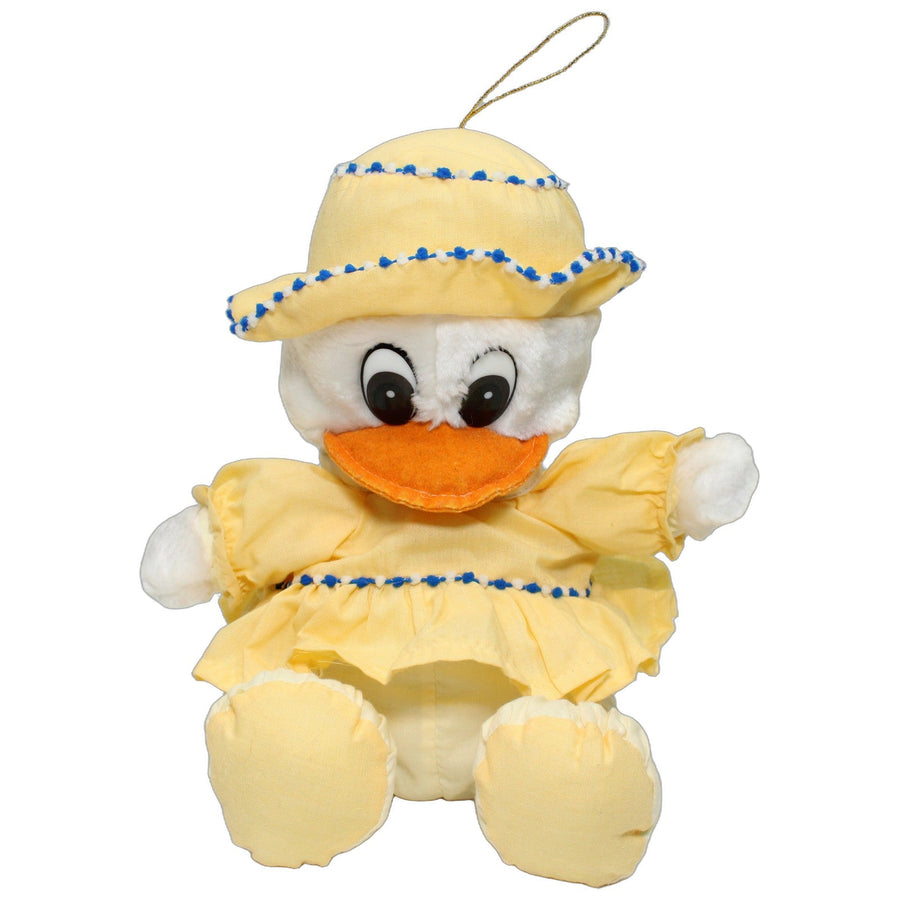 Süße Ente in gelben Outfit, sitzend