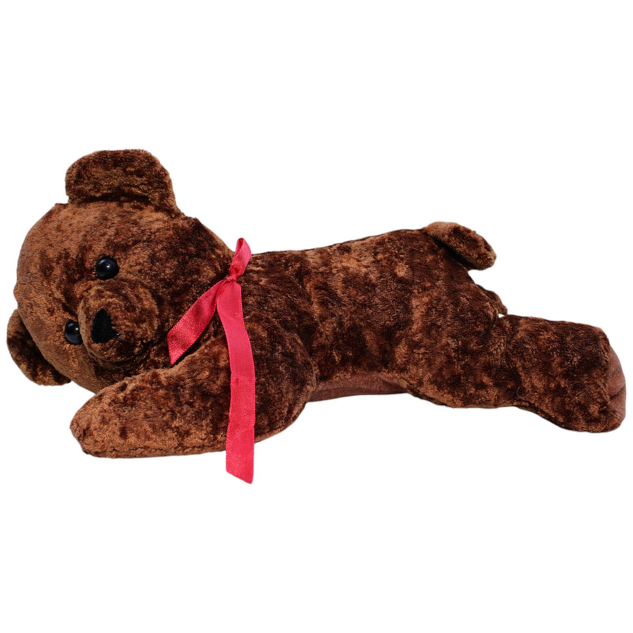 Liegender brauner Teddybär mit roter Schleife