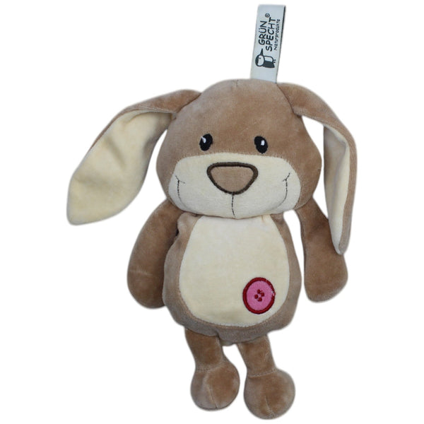 Süßer Hund mit rosa Knopf