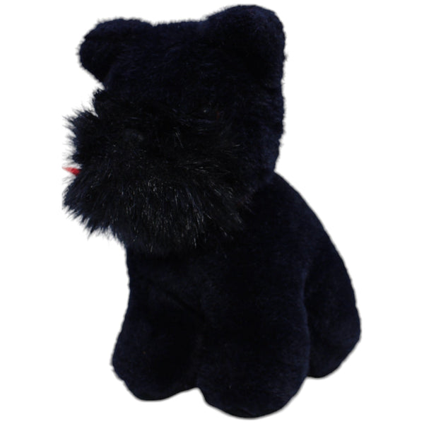 Scottish Terrier mit roter Schleife, sitzend
