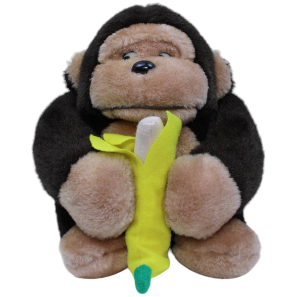 Affe mit Banane, sitzend