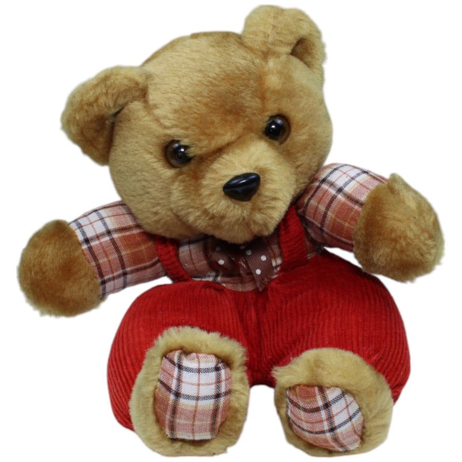 Süßer Teddybär in roter Latzhose