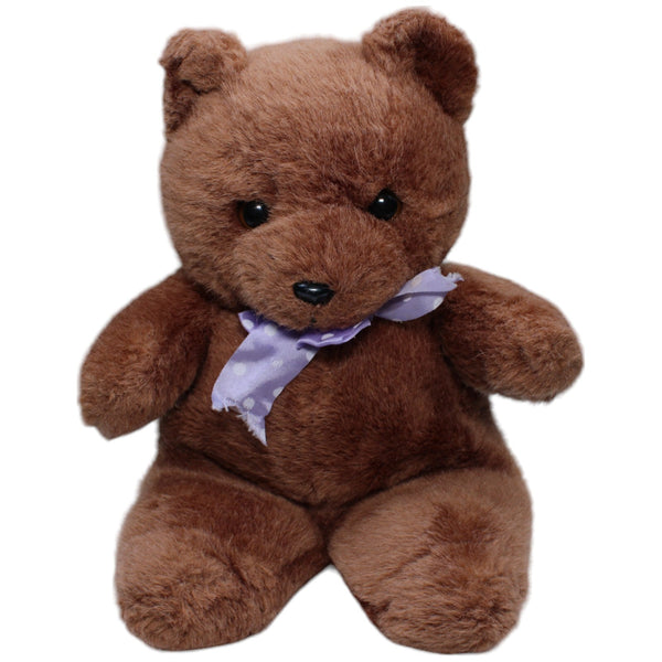 Schöner brauner Teddybär mit lila Schleife