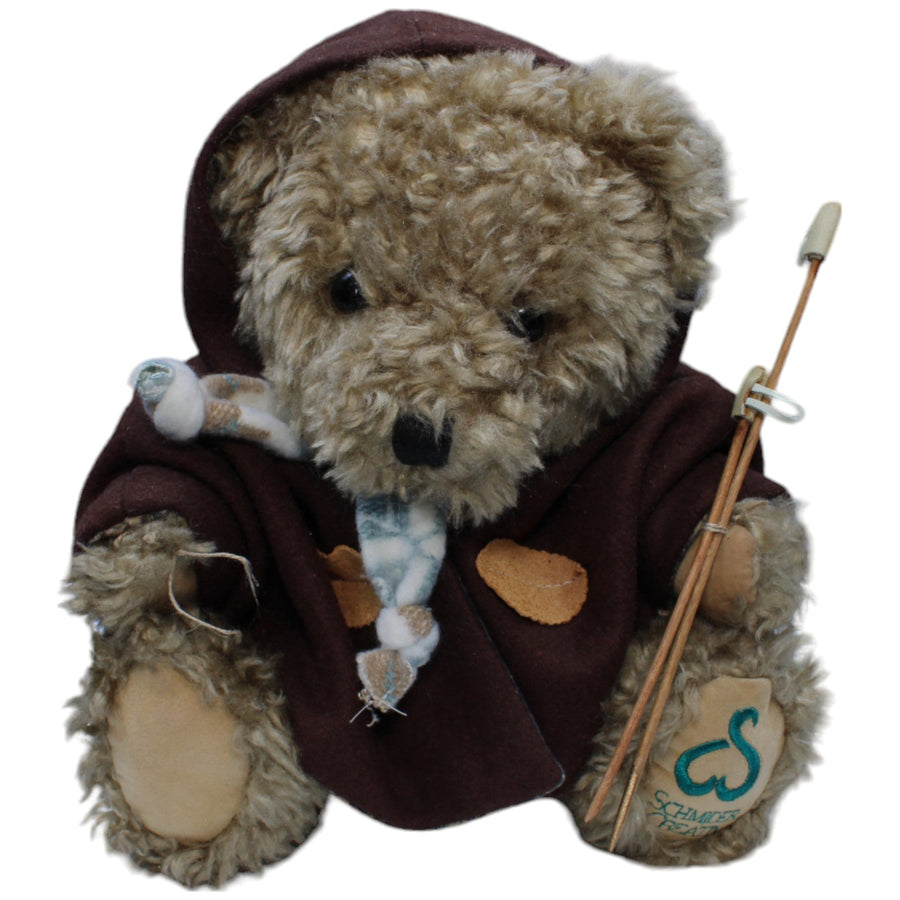 Teddybär sitzend mit Skistöcken