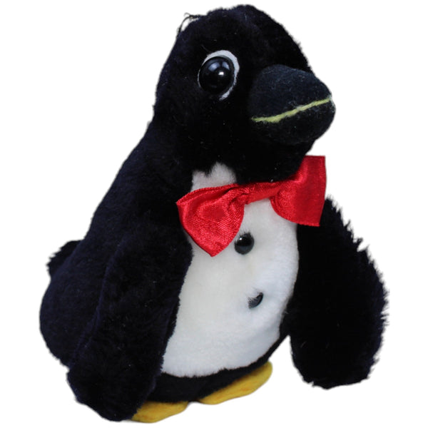 Pinguin mit roter Schleife