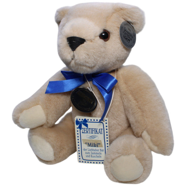 Beiger Teddybär Miki mit beweglichen Gliedern und blauer Schleife