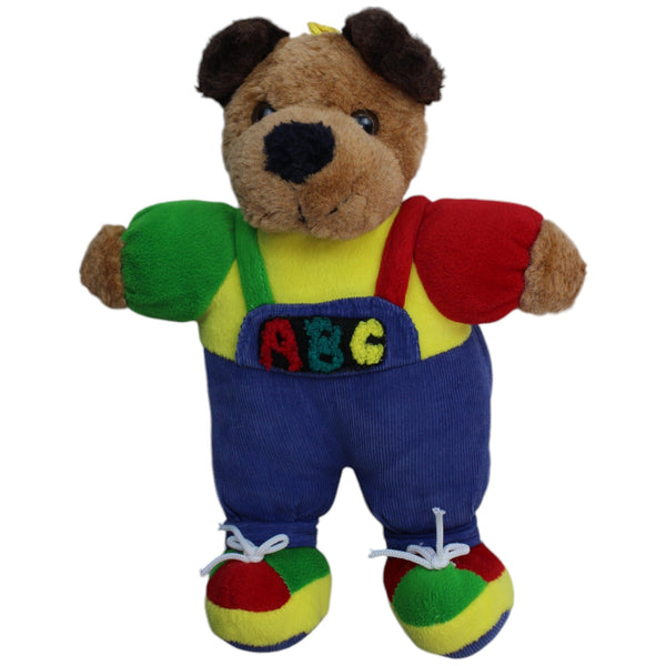 Hund mit bunter ABC-Latzhose