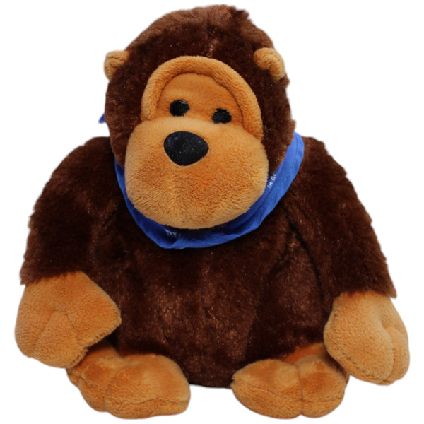 Affe mit blauem Halstuch, sitzend