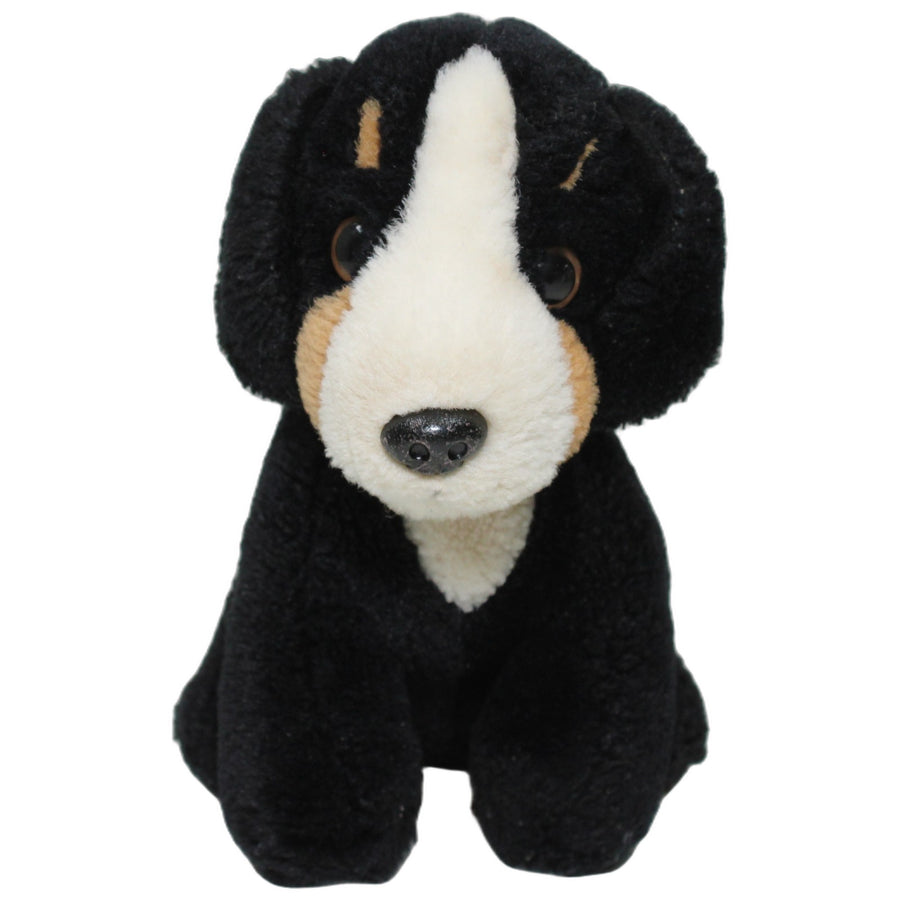 Schwarzer Hund, sitzend