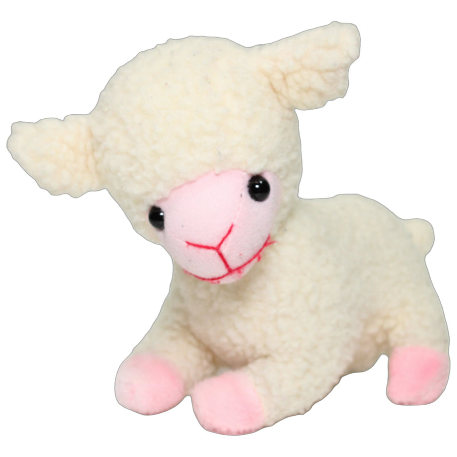 Cremefarbenes Lamm mit rosa Hufen