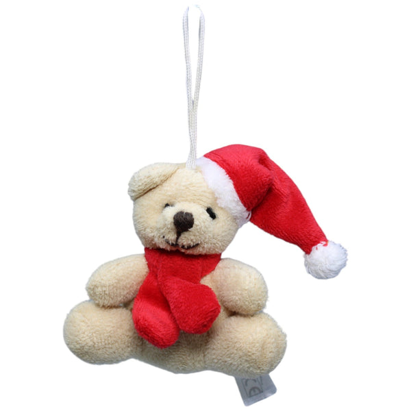 Teddybär mit Weihnachtsmütze und Schal