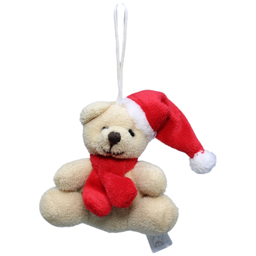Teddybär mit Weihnachtsmütze und Schal