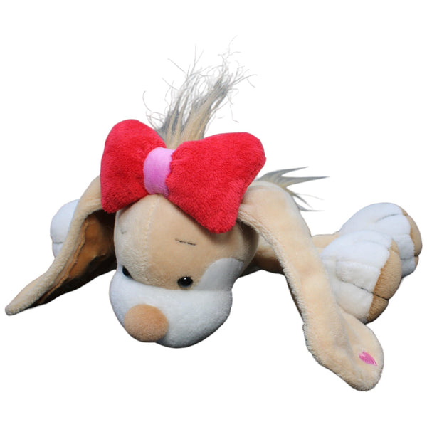 Hund Stupsi mit Schleife, liegend